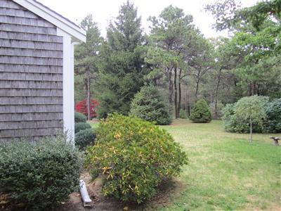 87 Foster Road Brewster, MA 02631 - Photo 13 of 15 a view of a tall brick building