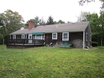 87 Foster Road Brewster, MA 02631 - Photo 14 of 15 a view of a house with a backyard