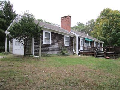 87 Foster Road Brewster, MA 02631 - Photo 15 of 15 a view of a house with backyard and sitting area