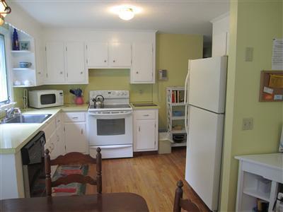 87 Foster Road Brewster, MA 02631 - Photo 2 of 15 a kitchen with a refrigerator sink and cabinets