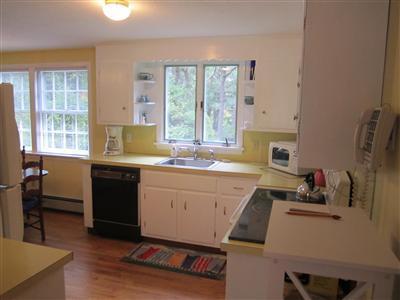87 Foster Road Brewster, MA 02631 - Photo 3 of 15 a kitchen with a sink cabinets and appliances