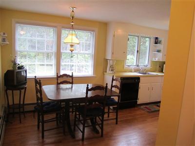 87 Foster Road Brewster, MA 02631 - Photo 5 of 15 a view of a a dining room with furniture window and wooden floor