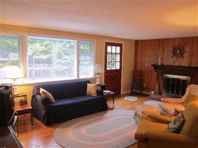 87 Foster Road Brewster, MA 02631 - Photo 6 of 15 a living room with furniture and a fireplace