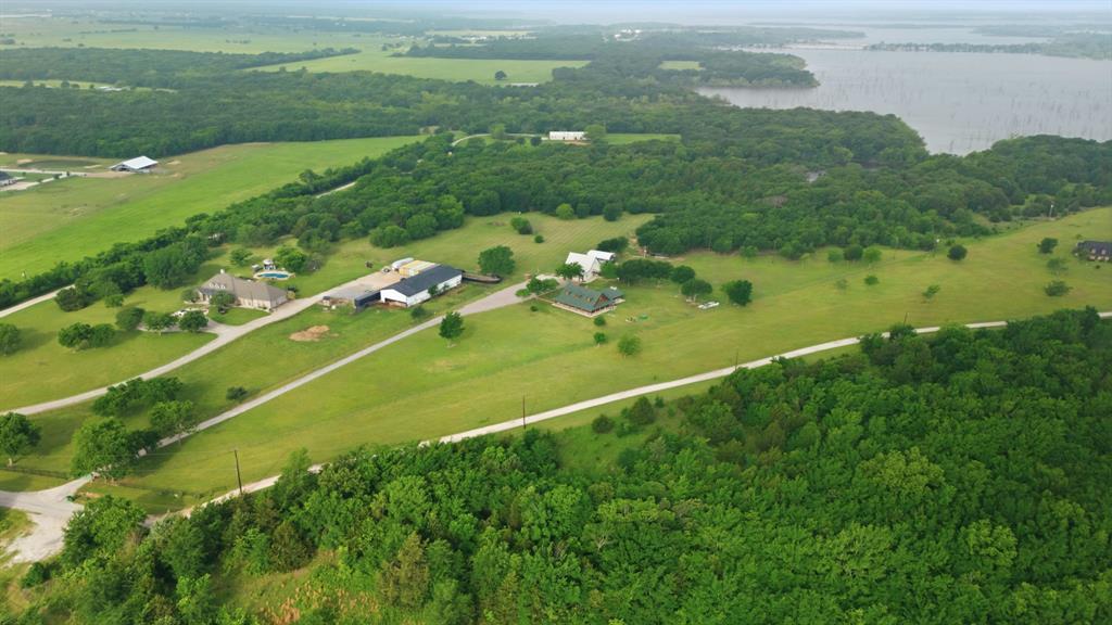 465 Emberson Ranch Road Pilot Point, TX 76258 - Photo 39 of 40 a view of a lake with a city