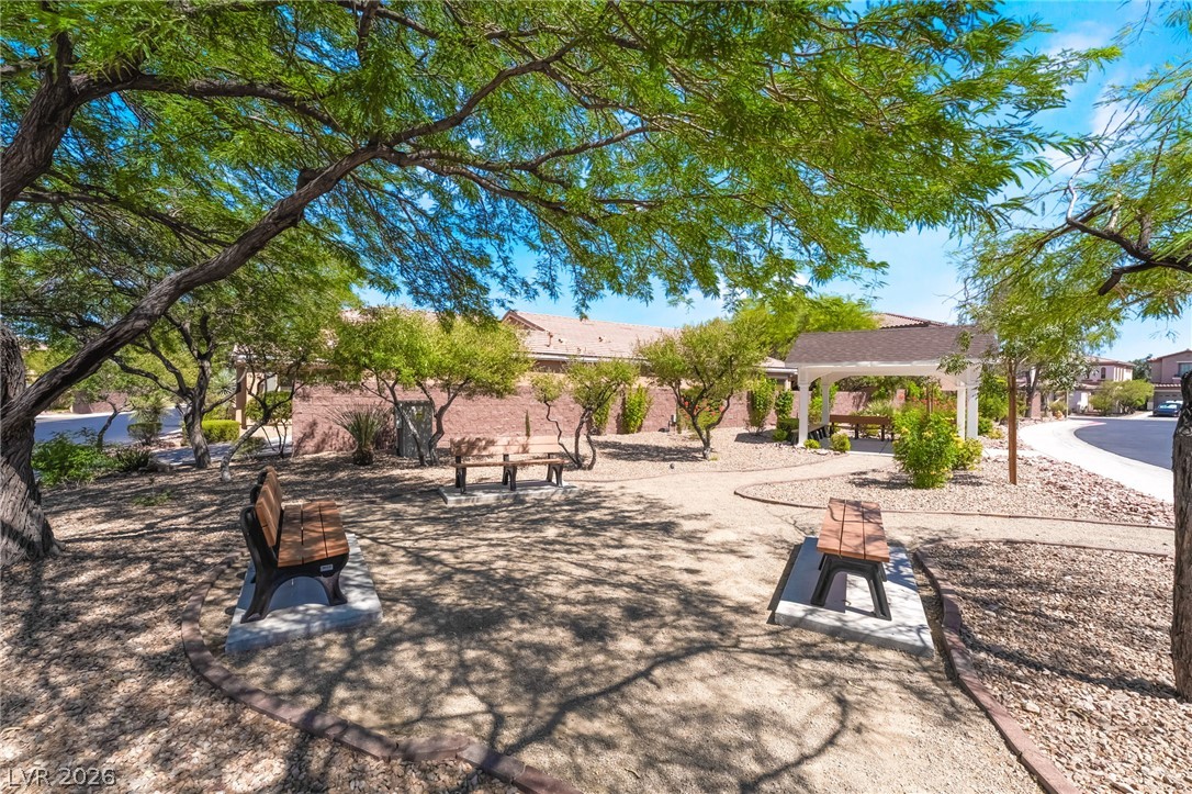 8358 Nelson Ridge Lane Las Vegas, NV 89178 - Photo 41 of 43 A tranquil park area offers benches and a shaded gazebo for leisurely enjoyment.