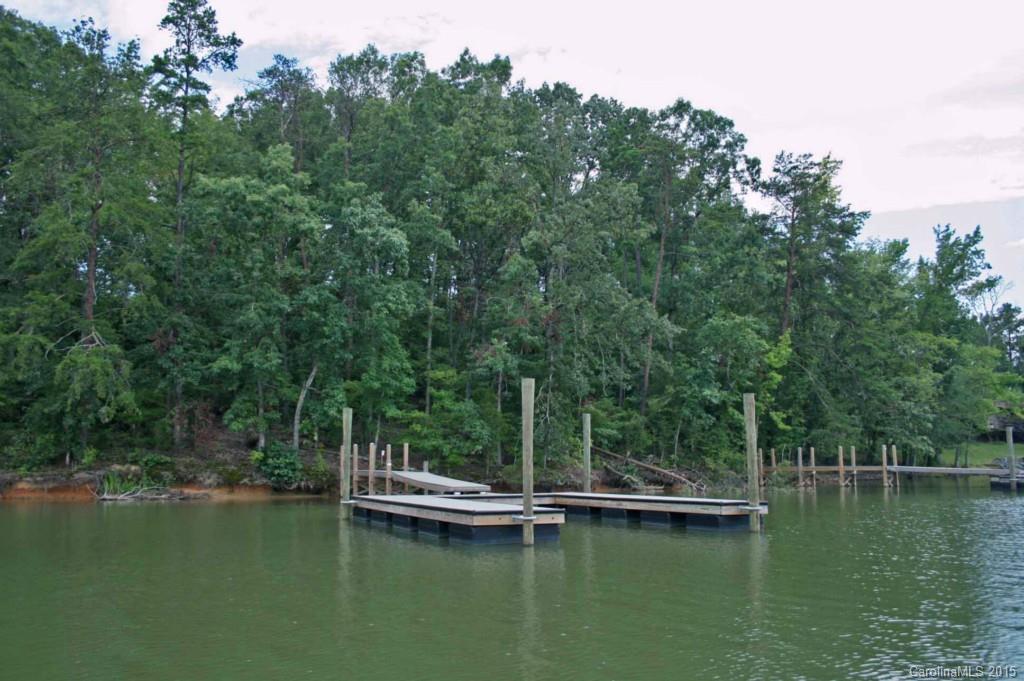 376 Calming Way Tega Cay, SC 29708 - Photo 3 of 3 a view of a lake with trees in front of it