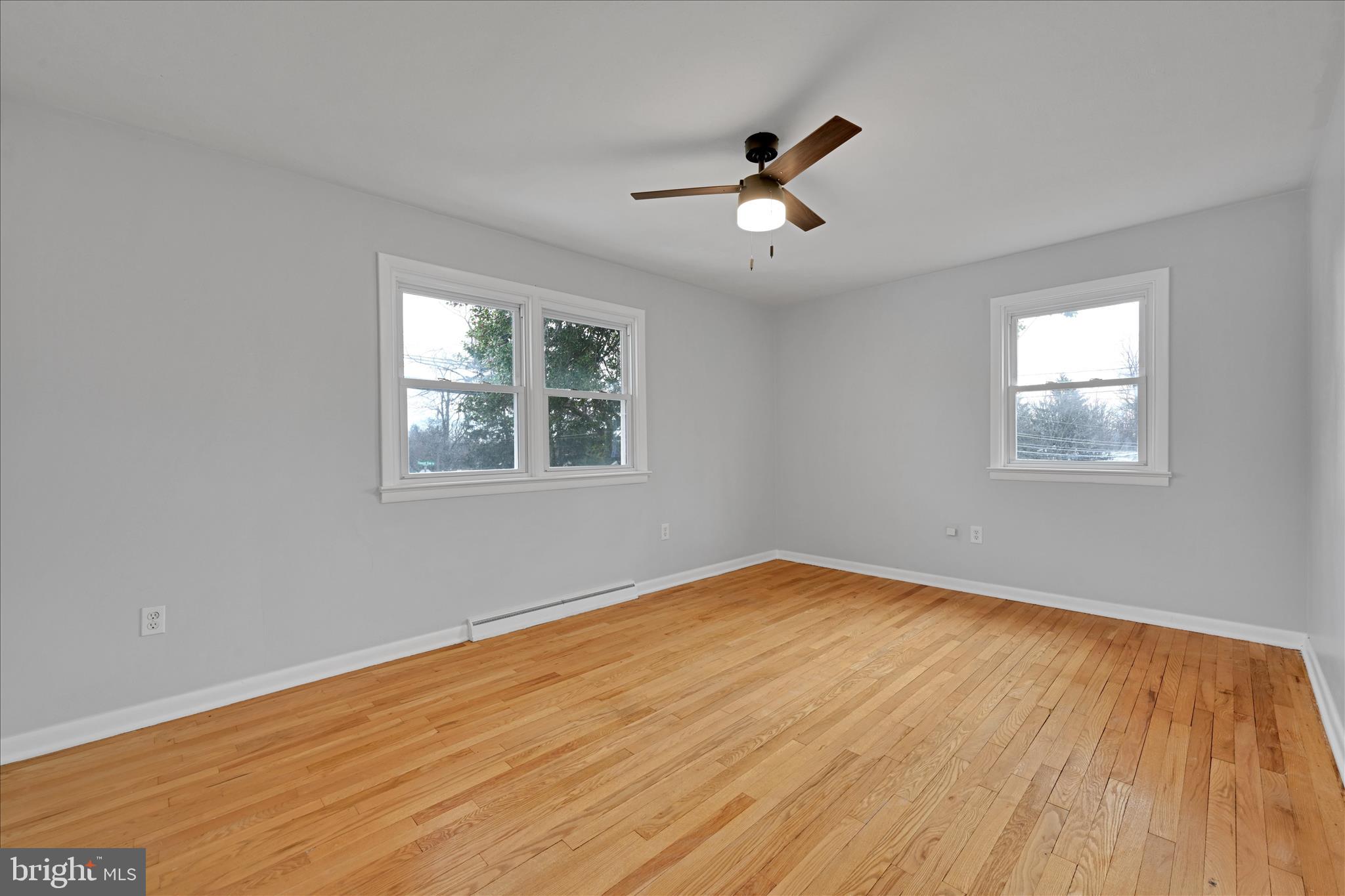 465 Pleasant View Road New Cumberland, PA 17070 - Photo 17 of 31 a view of empty room with wooden floor and fan