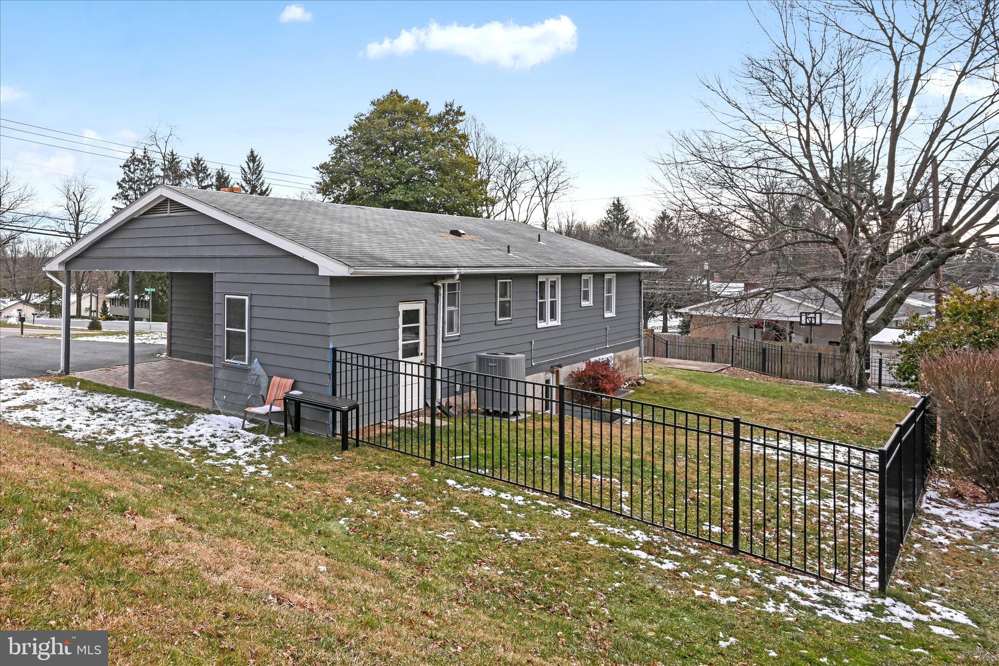 465 Pleasant View Road New Cumberland, PA 17070 - Photo 31 of 31 a view of a house with a wooden deck and a yard