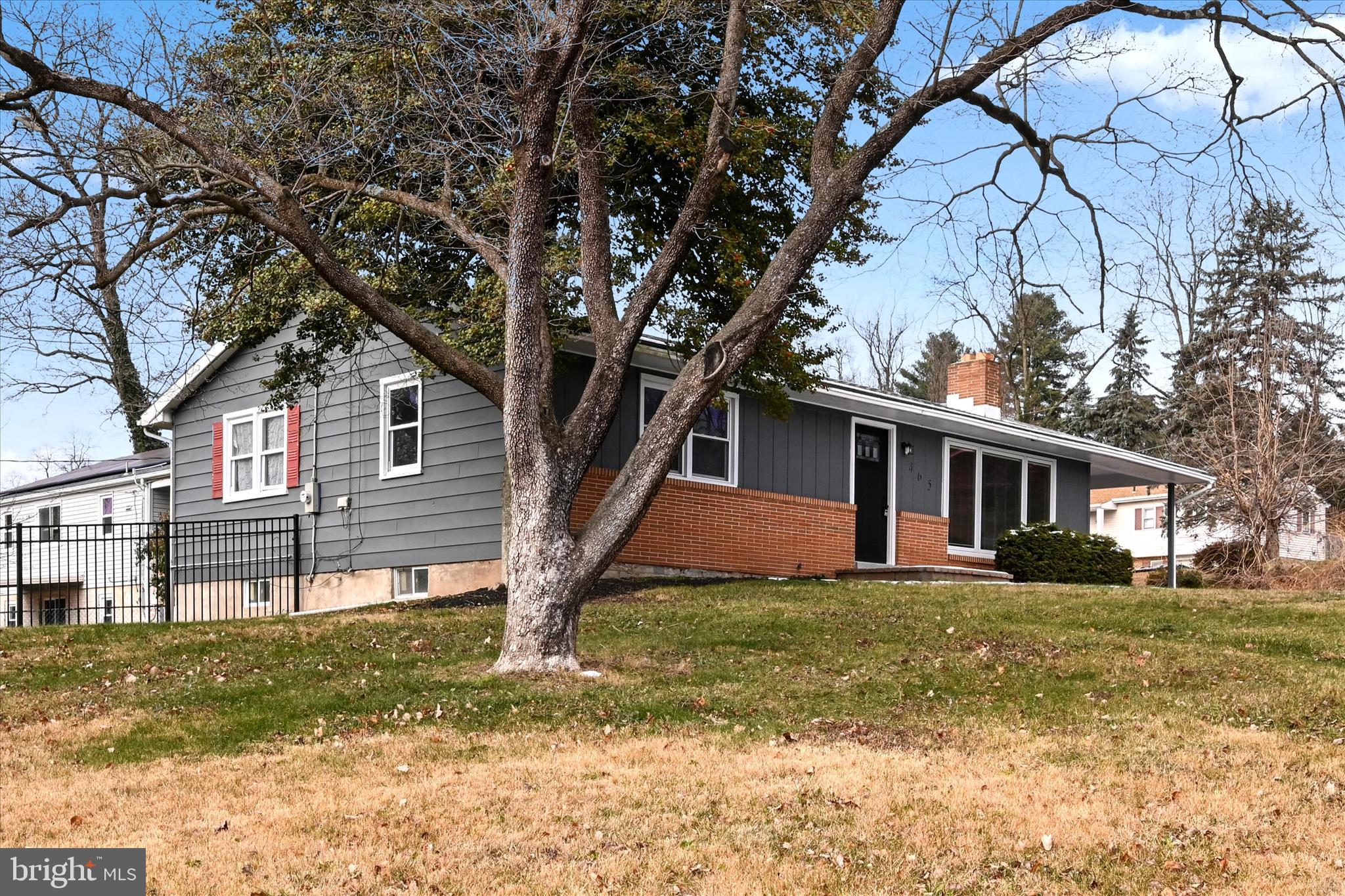 465 Pleasant View Road New Cumberland, PA 17070 - Photo 6 of 31 a view of a yard in front of a house with large trees