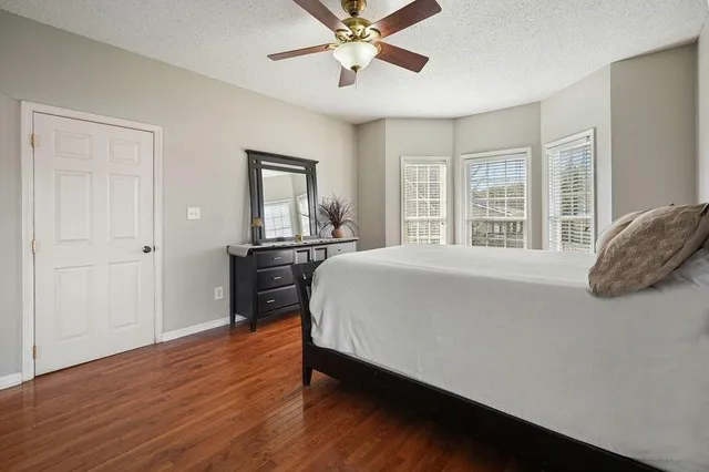 a work room with furniture and a wooden floor