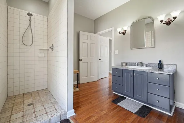 a bathroom with a sink and a large mirror