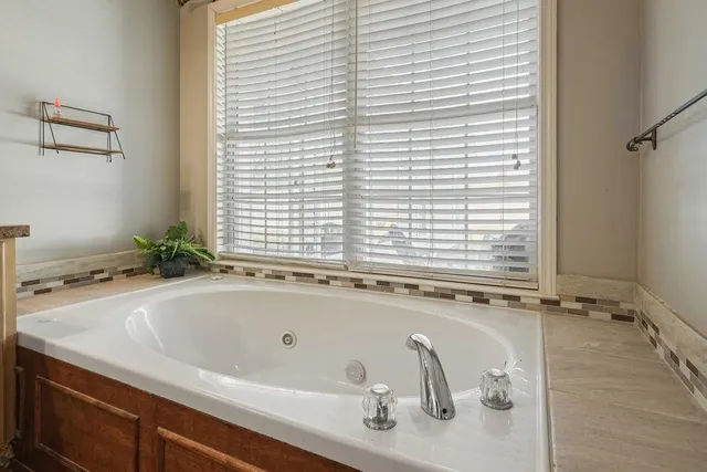 a view of a balcony with wooden floor