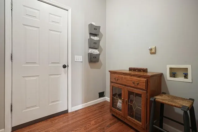 a view of a lake with houses in the back