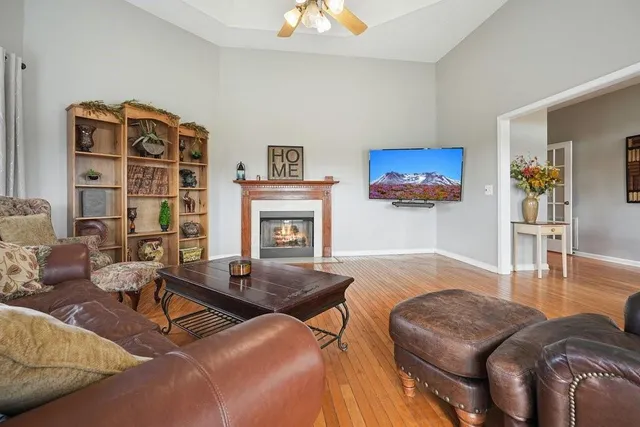 a kitchen with stainless steel appliances granite countertop a refrigerator a stove top oven a sink dishwasher and wooden cabinets