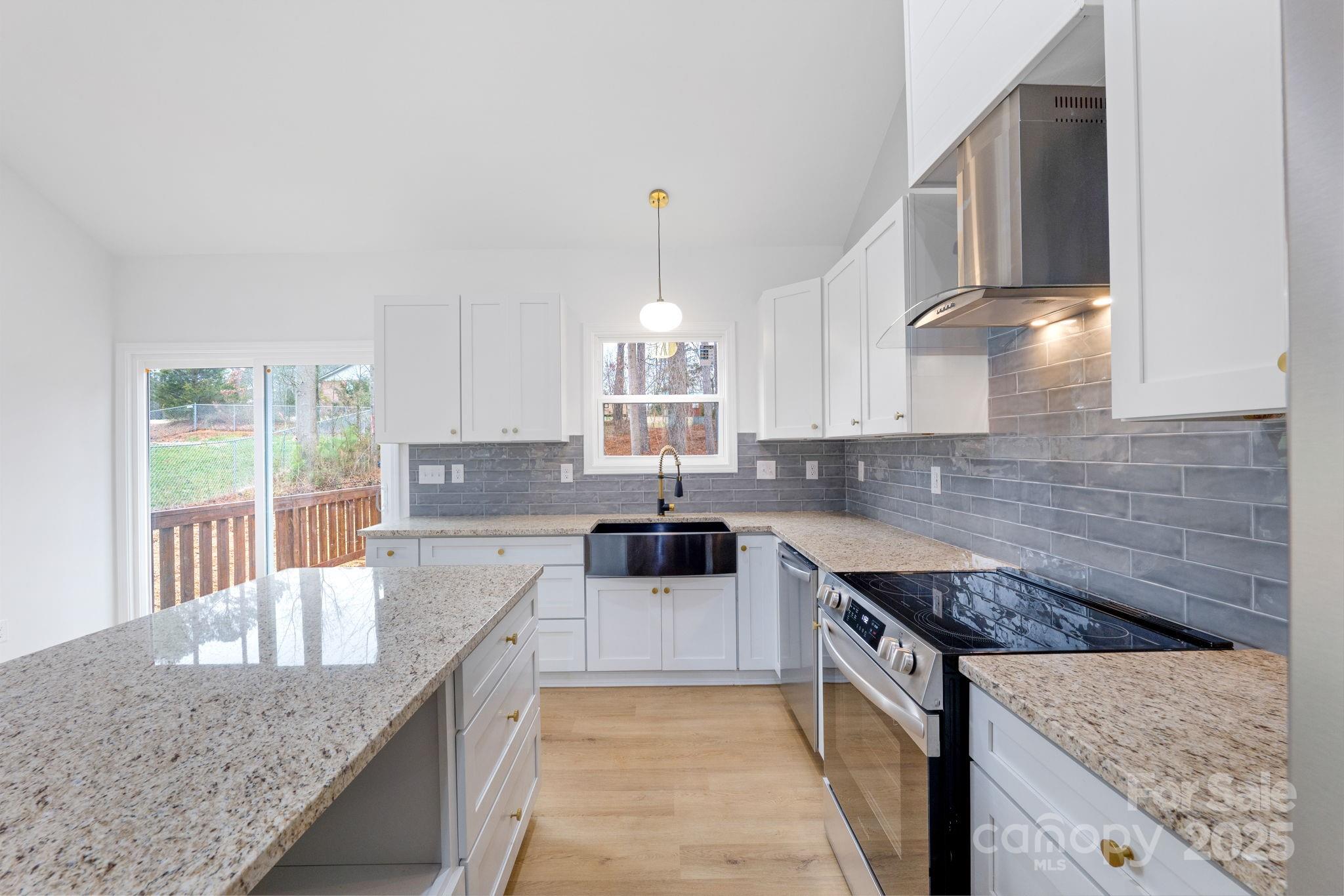 203 Bud Black Road Crouse, NC 28033 - Photo 12 of 47 a kitchen with granite countertop a sink a counter top space and cabinets