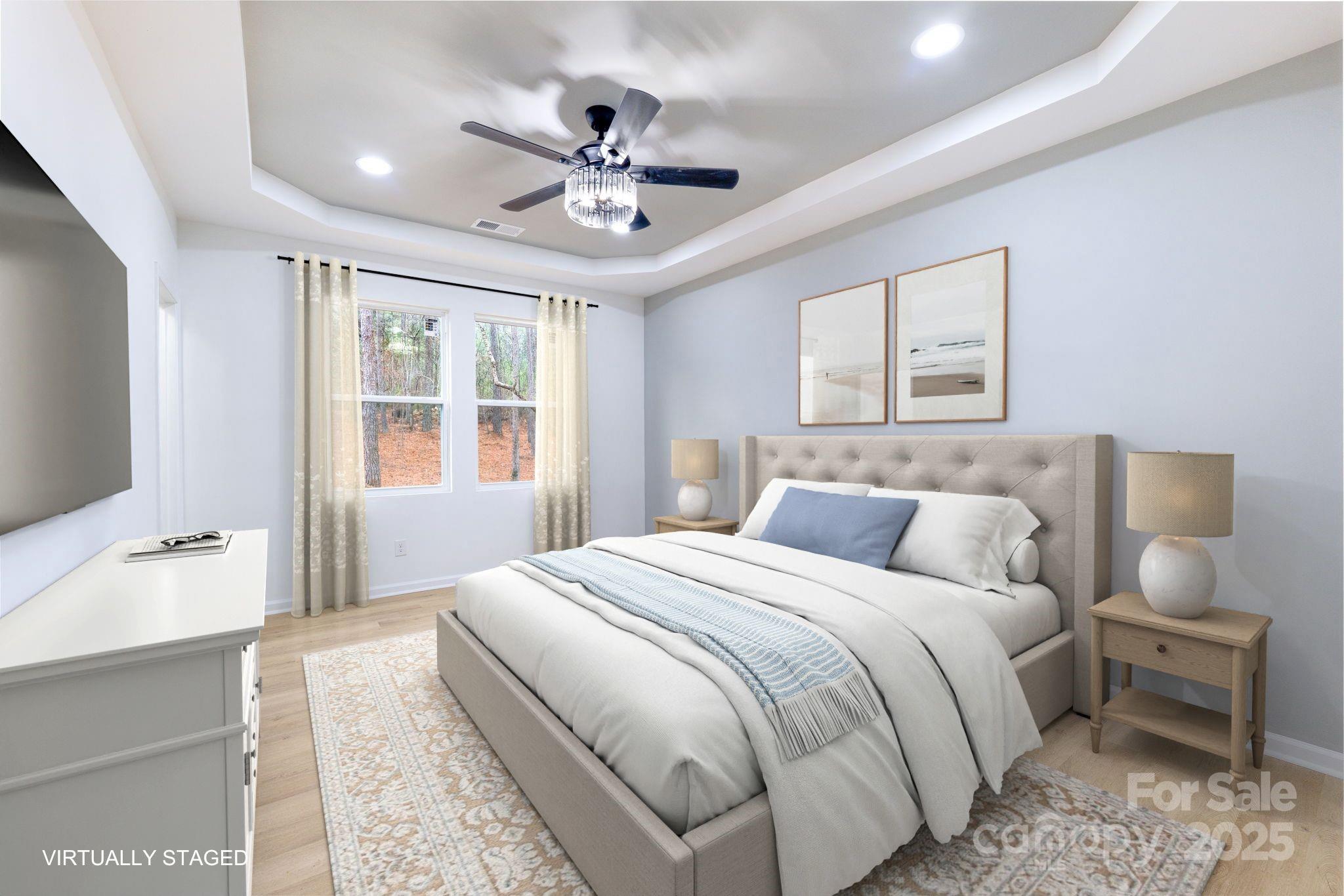 203 Bud Black Road Crouse, NC 28033 - Photo 15 of 47 a bedroom with a large bed and a chandelier