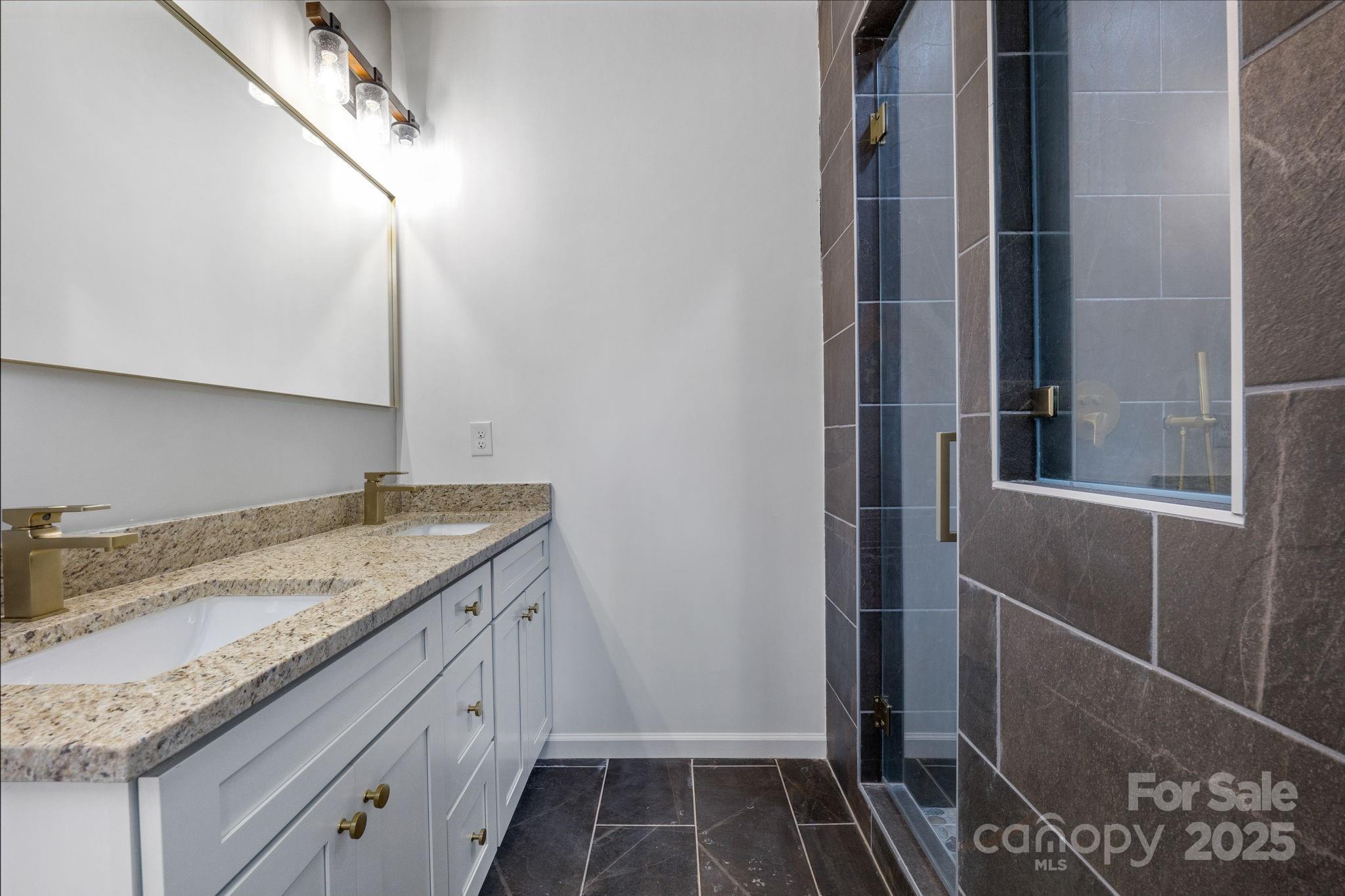 203 Bud Black Road Crouse, NC 28033 - Photo 17 of 47 a bathroom with a granite countertop sink and a mirror