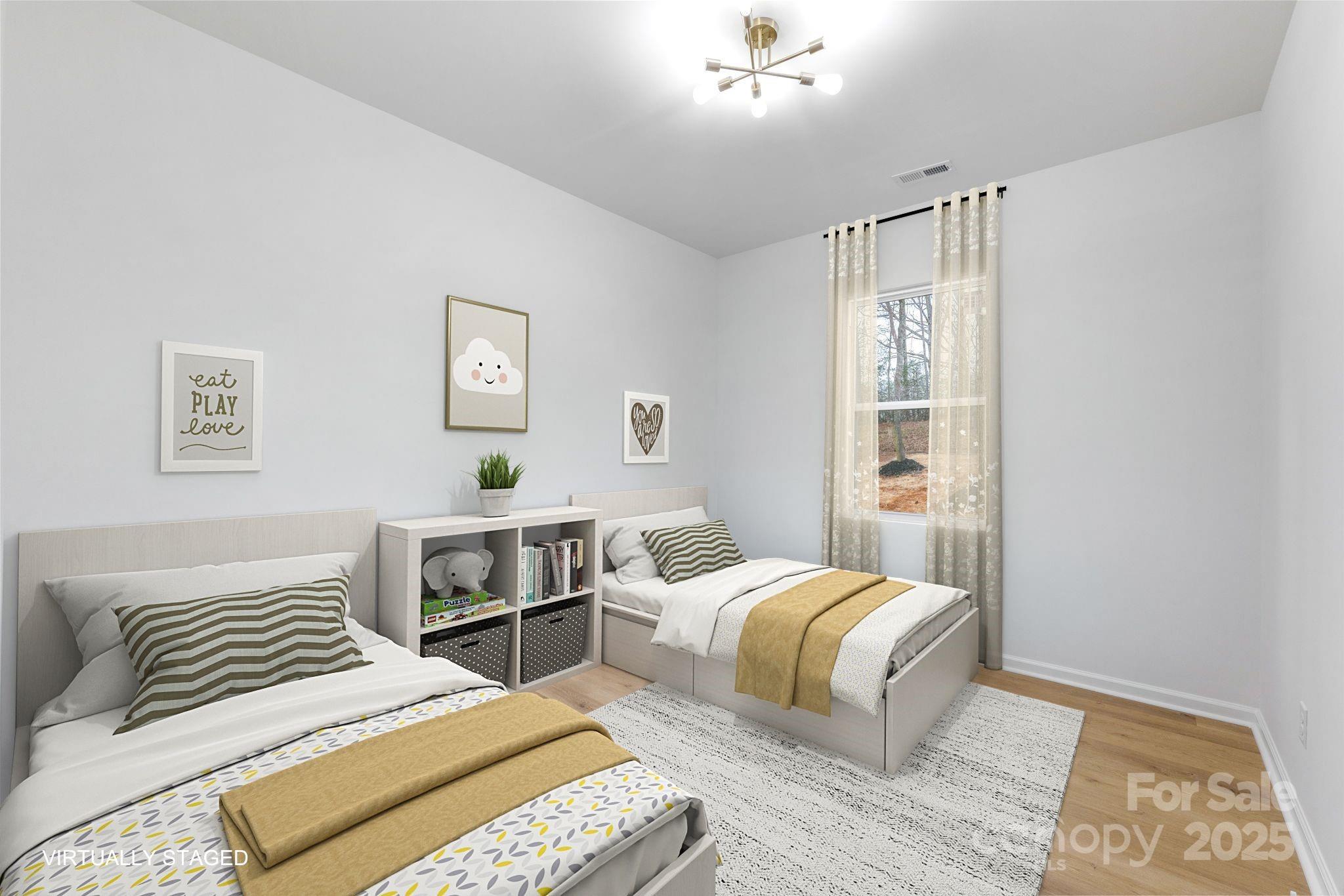 203 Bud Black Road Crouse, NC 28033 - Photo 20 of 47 a bedroom with a bed and a chandelier