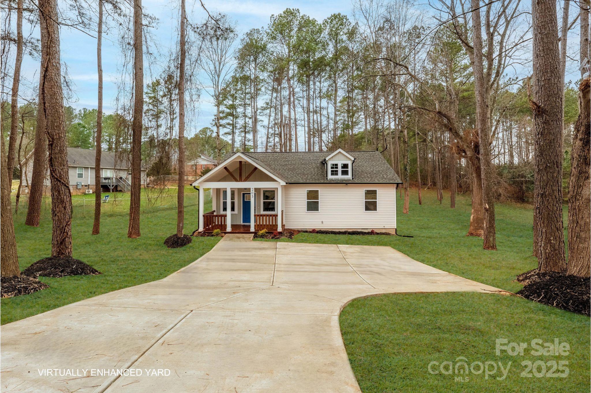 203 Bud Black Road Crouse, NC 28033 - Photo 2 of 47 a front view of a house with a yard and trees