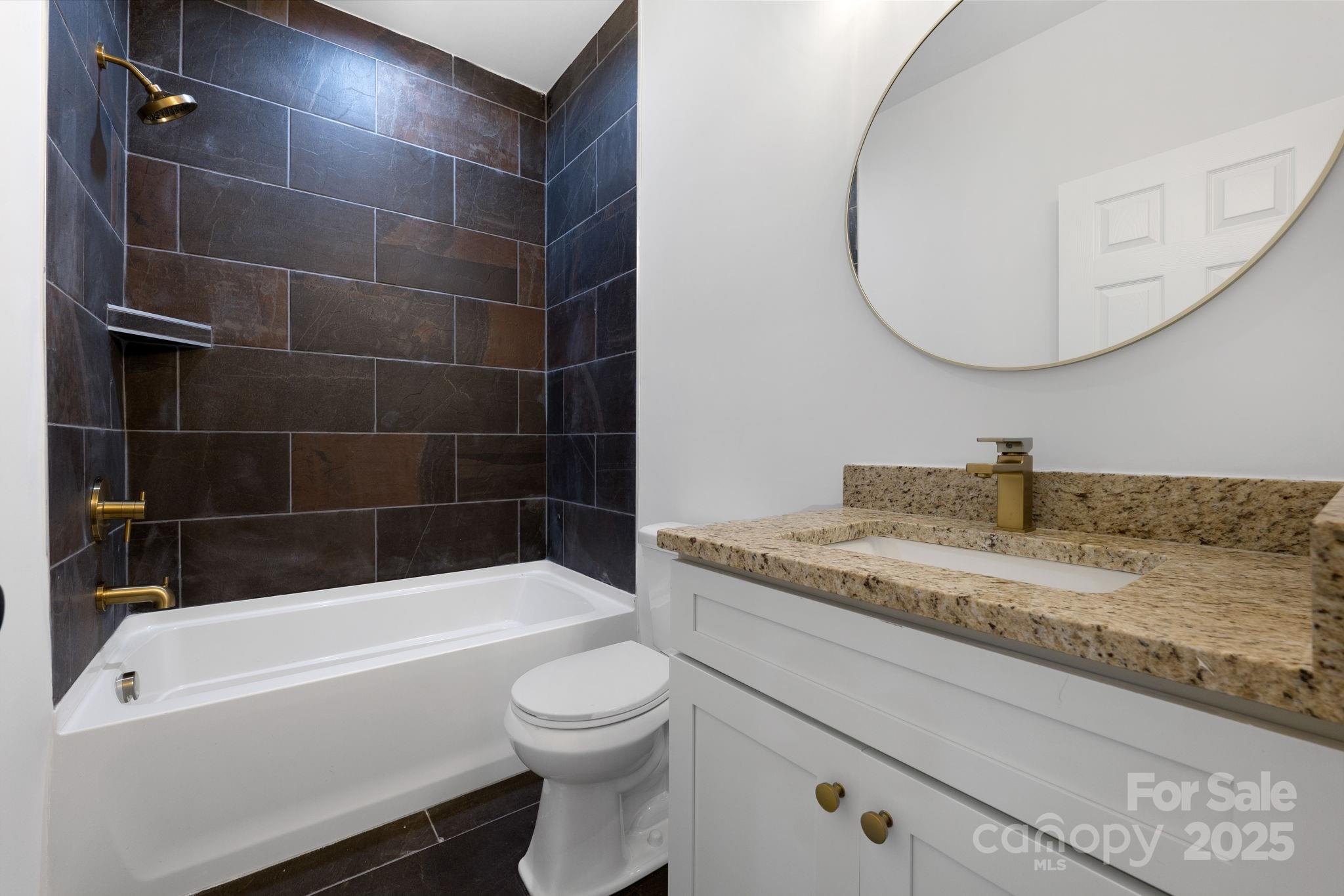 203 Bud Black Road Crouse, NC 28033 - Photo 21 of 47 a bathroom with a granite countertop bathtub sink vanity mirror and toilet