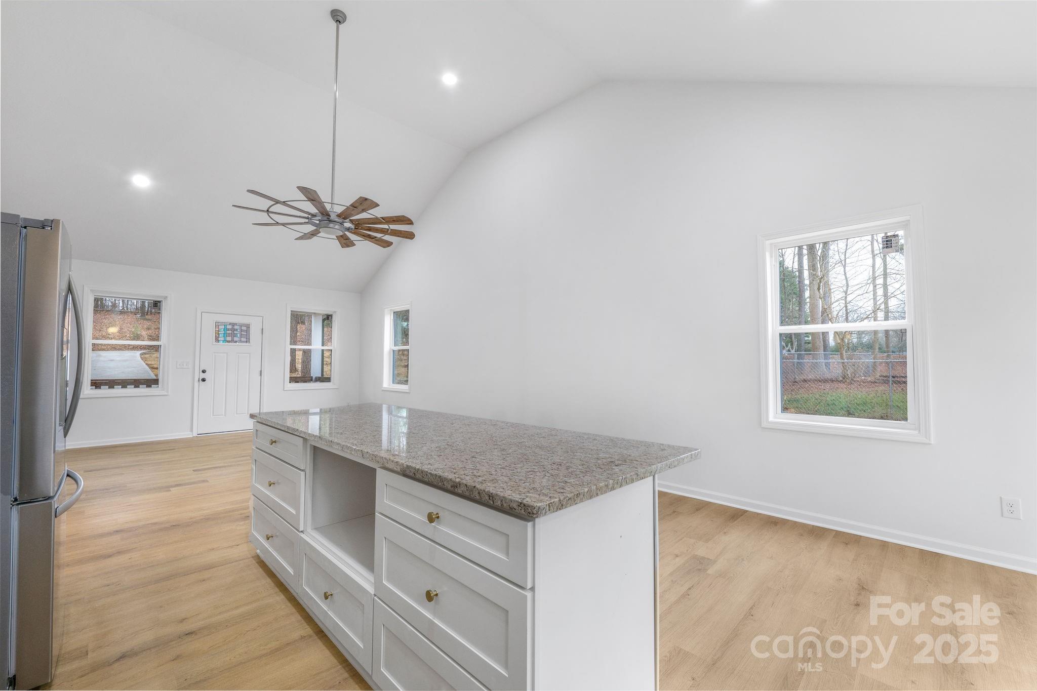 203 Bud Black Road Crouse, NC 28033 - Photo 26 of 47 a kitchen with granite countertop a stove and a sink