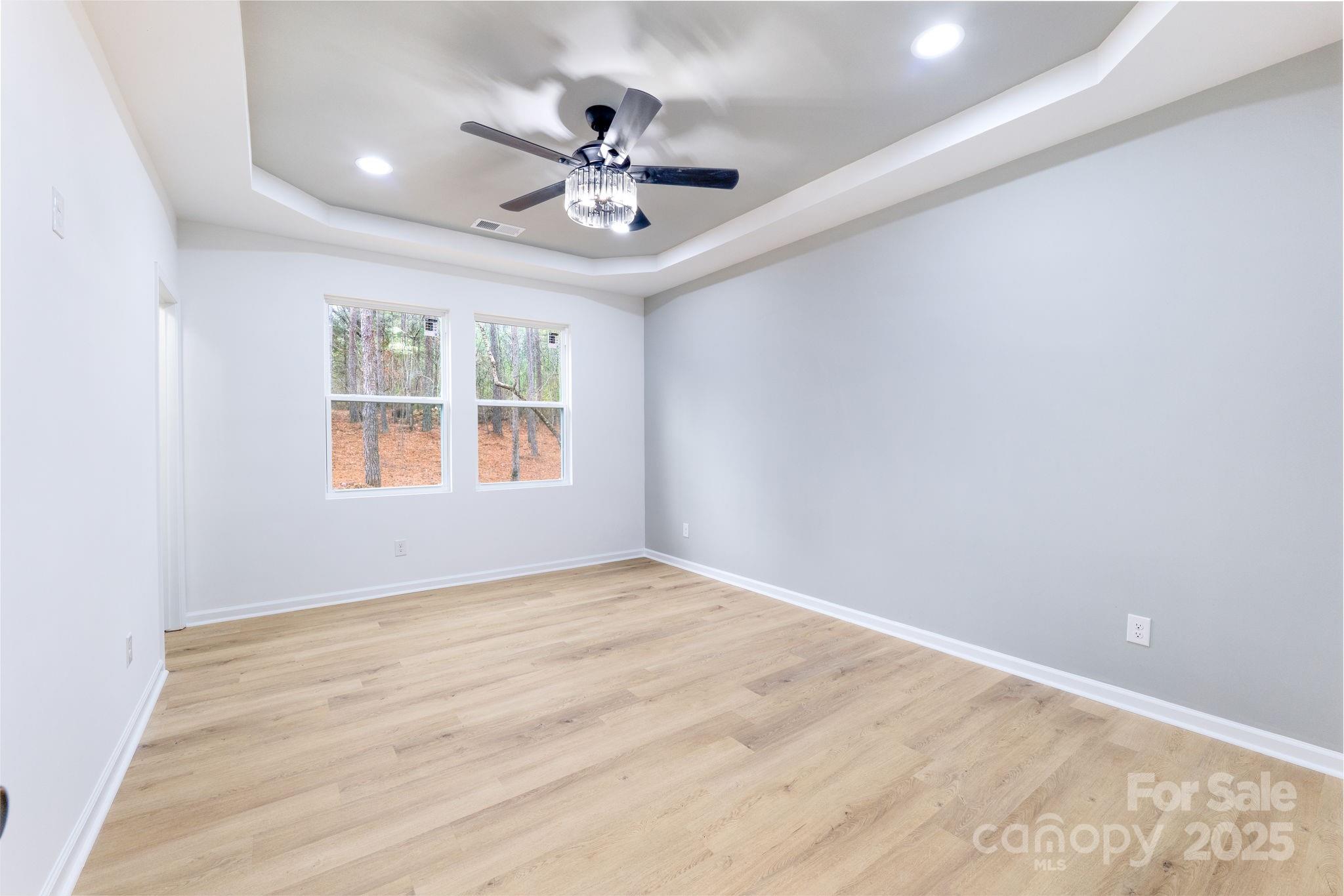 203 Bud Black Road Crouse, NC 28033 - Photo 28 of 47 an empty room with windows and ceiling fan