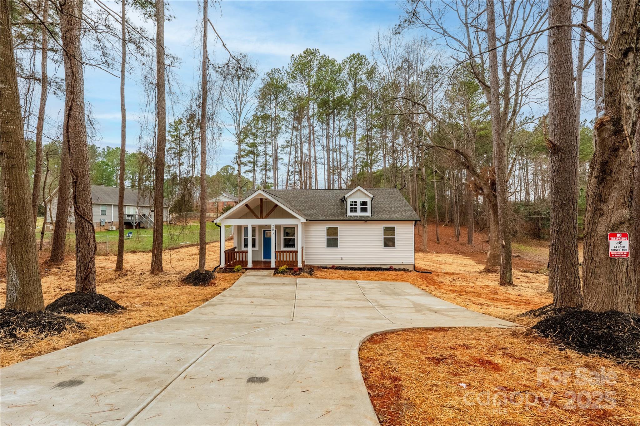 203 Bud Black Road Crouse, NC 28033 - Photo 33 of 47 a view of a house with a snow in the yard