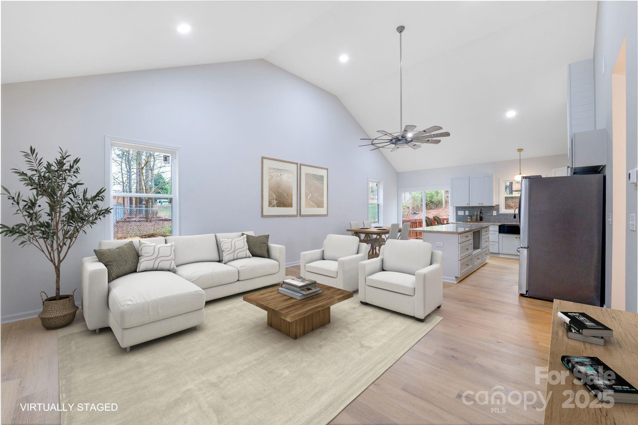 203 Bud Black Road Crouse, NC 28033 - Photo 6 of 47 a living room with furniture a chandelier and a flat screen tv
