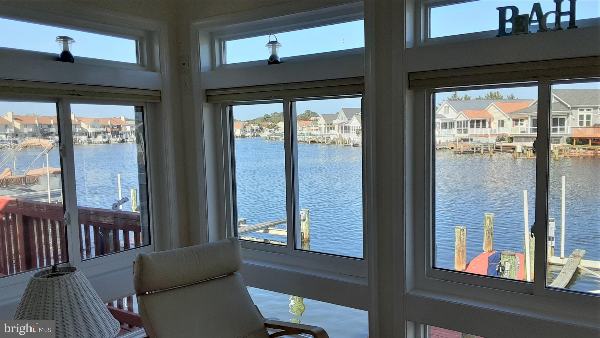 192 Pine Tree Road Ocean City, MD 21842 - Photo 22 of 66 Sunroom overlooks the water and has it's own HVAC.
