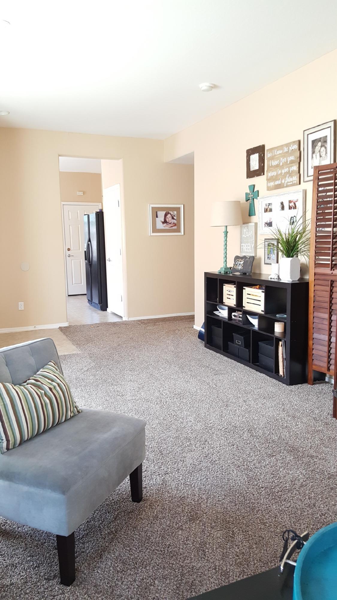 26132 West Burnett Road Buckeye, AZ 85396 - Photo 11 of 22 a living room with furniture