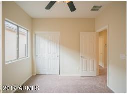 26132 West Burnett Road Buckeye, AZ 85396 - Photo 15 of 22 a view of an empty room with a window