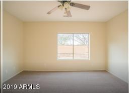 26132 West Burnett Road Buckeye, AZ 85396 - Photo 17 of 22 an empty room with a window