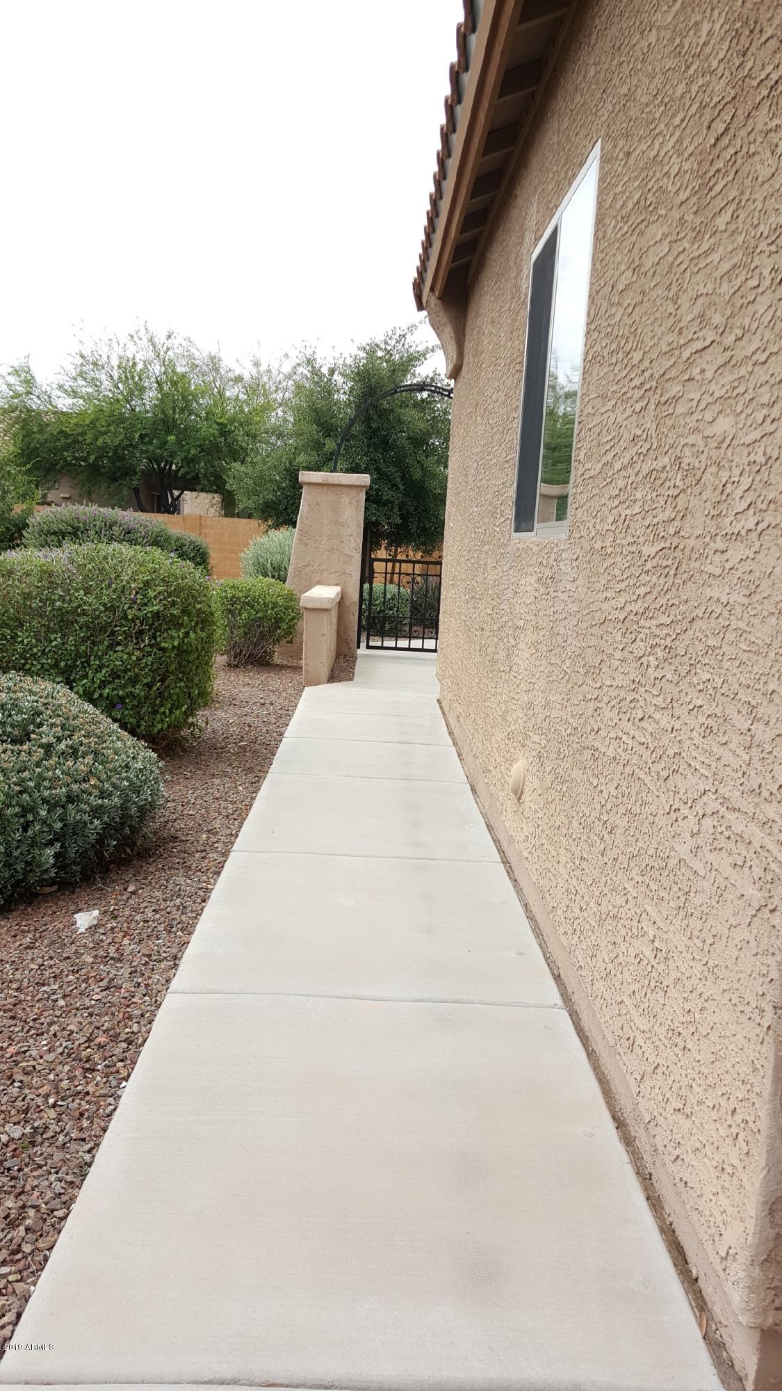 26132 West Burnett Road Buckeye, AZ 85396 - Photo 5 of 22 a view of a back yard of the house