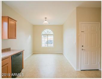 26132 West Burnett Road Buckeye, AZ 85396 - Photo 8 of 22 a view of an empty room with a window