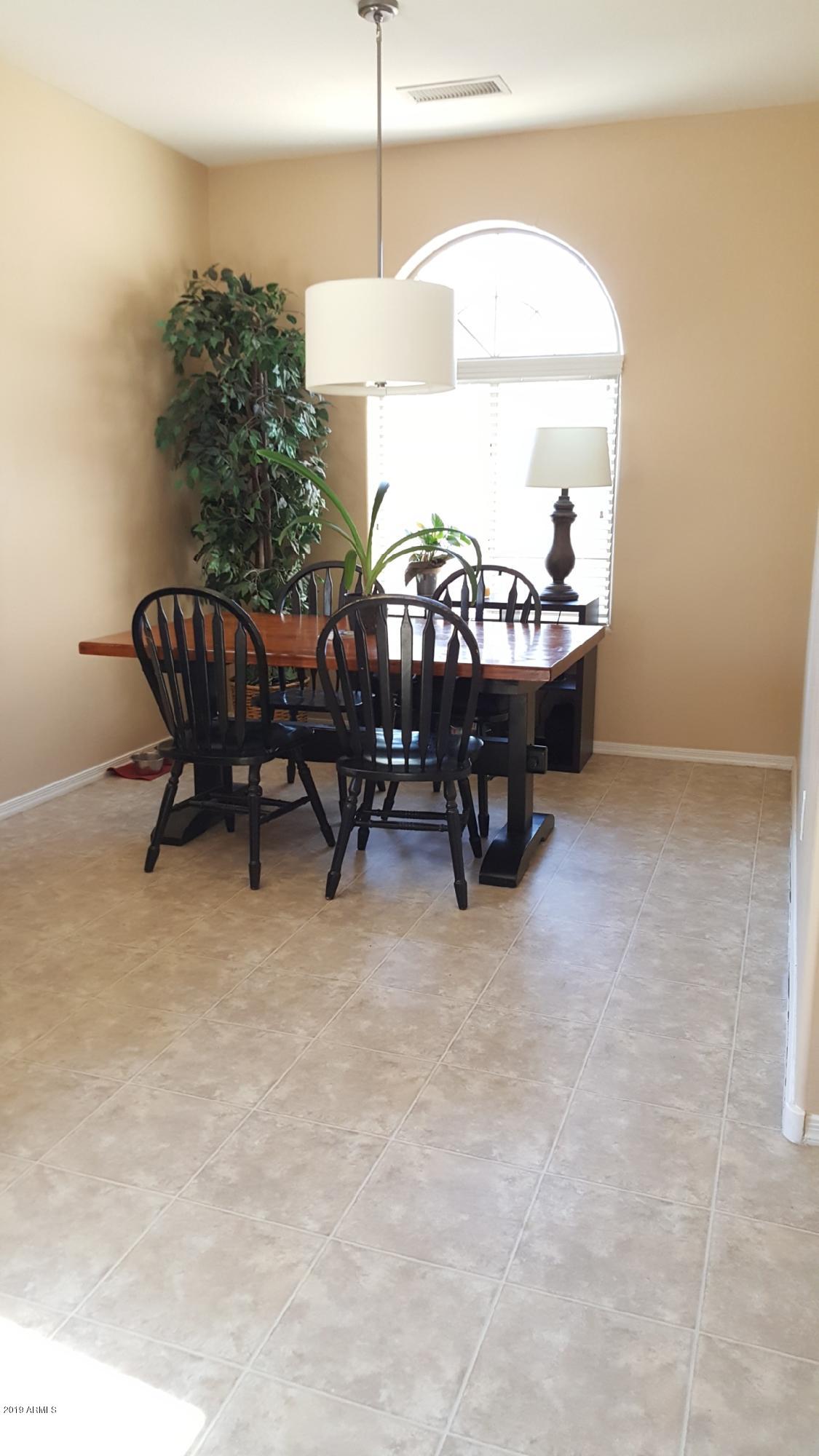 26132 West Burnett Road Buckeye, AZ 85396 - Photo 9 of 22 a living room with furniture