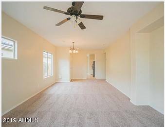 26132 West Burnett Road Buckeye, AZ 85396 - Photo 10 of 22 a view of an empty room with a window