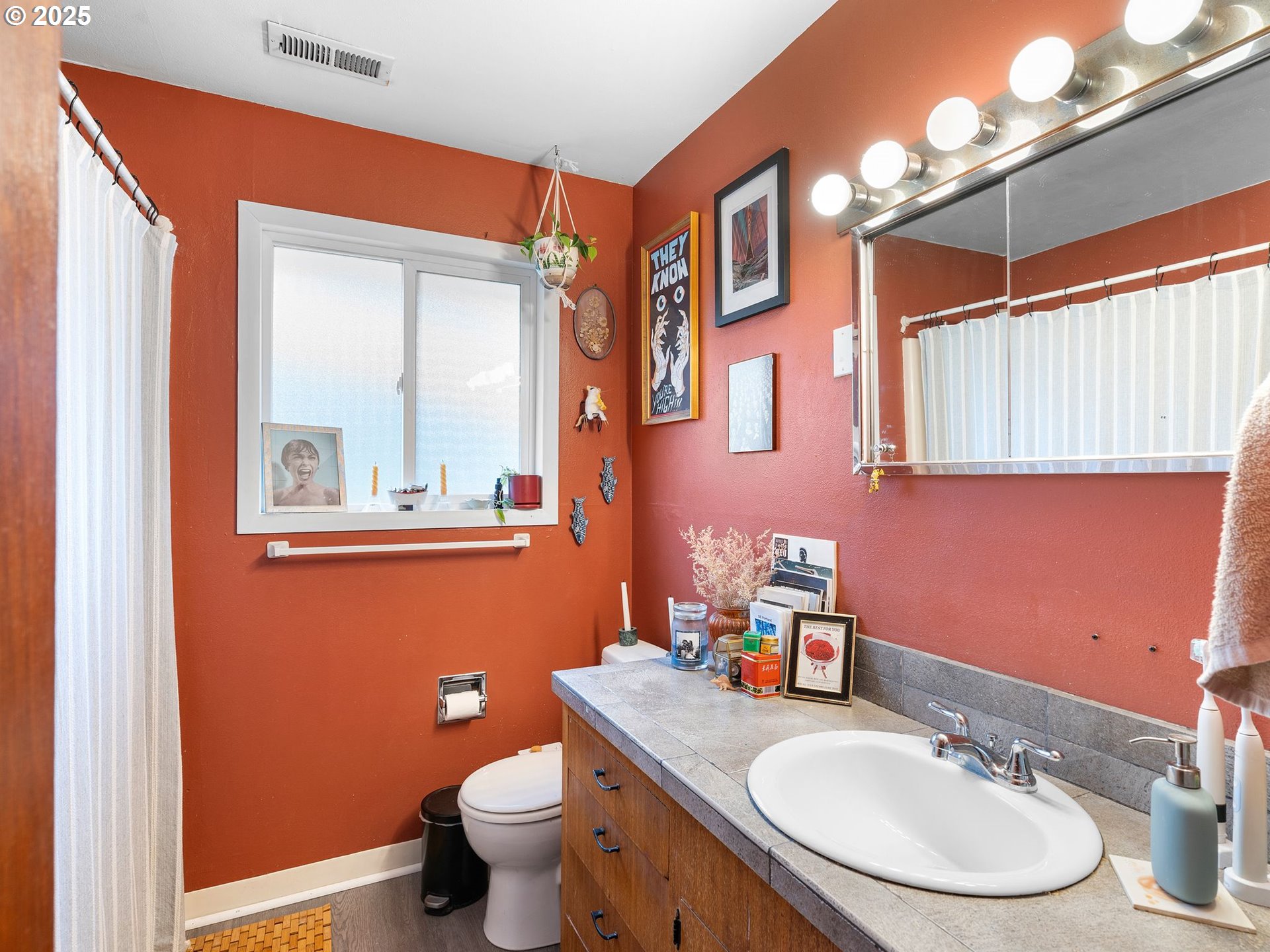1245 Northeast 118th Avenue Portland, OR 97220 - Photo 10 of 35 a bathroom with a toilet sink and mirror