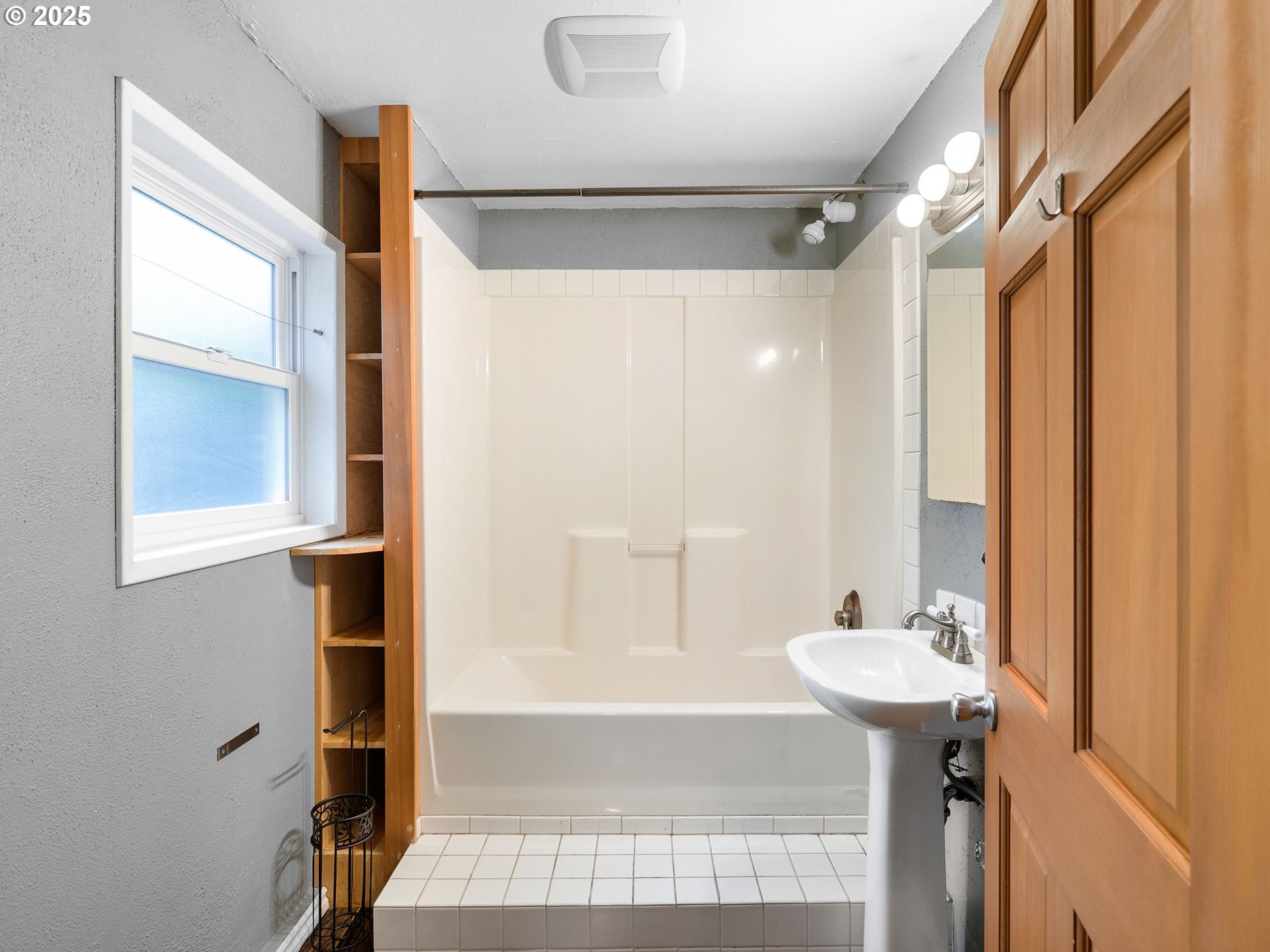 1245 Northeast 118th Avenue Portland, OR 97220 - Photo 16 of 35 a bathroom with a sink shower and a mirror