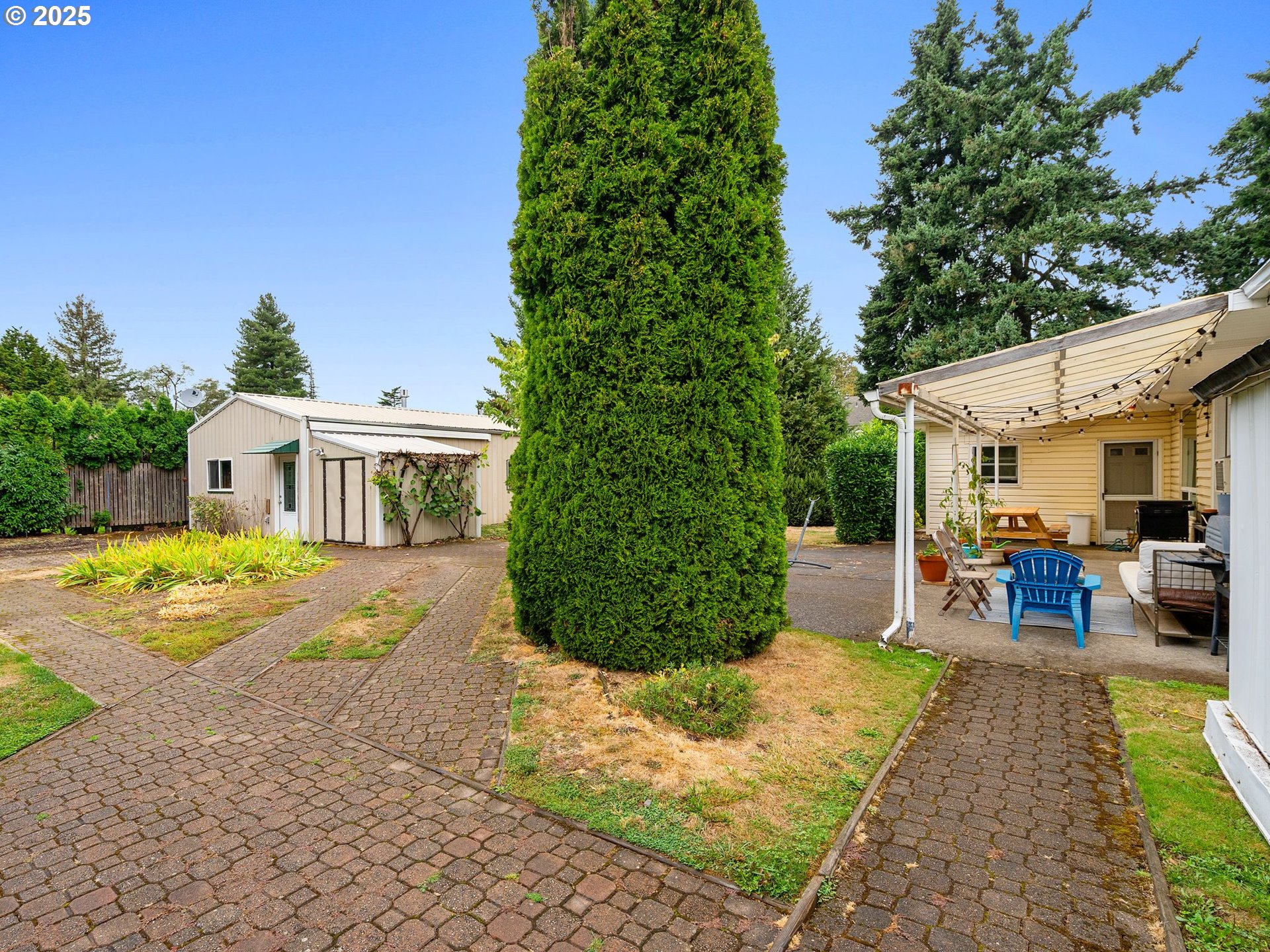 1245 Northeast 118th Avenue Portland, OR 97220 - Photo 18 of 35 a view of a house with backyard and sitting area