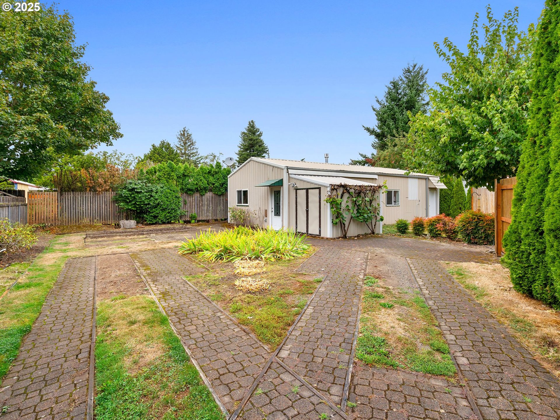 1245 Northeast 118th Avenue Portland, OR 97220 - Photo 19 of 35 a front view of a house with yard patio and green space
