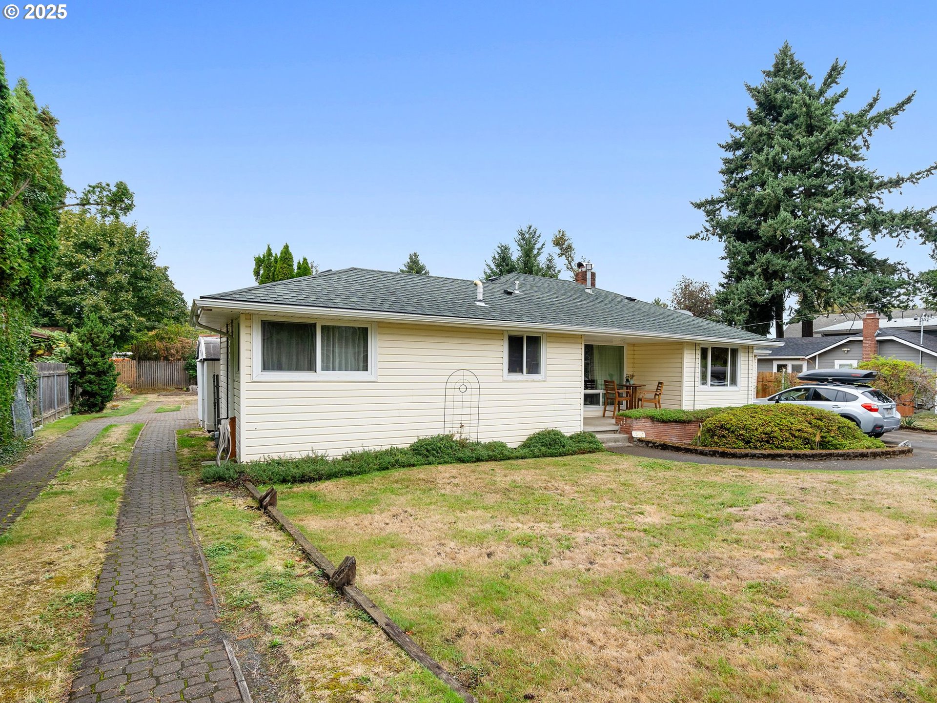 1245 Northeast 118th Avenue Portland, OR 97220 - Photo 2 of 35 a white house that has a tree in front of it