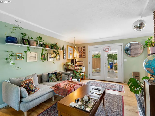 a living room with furniture and a rug
