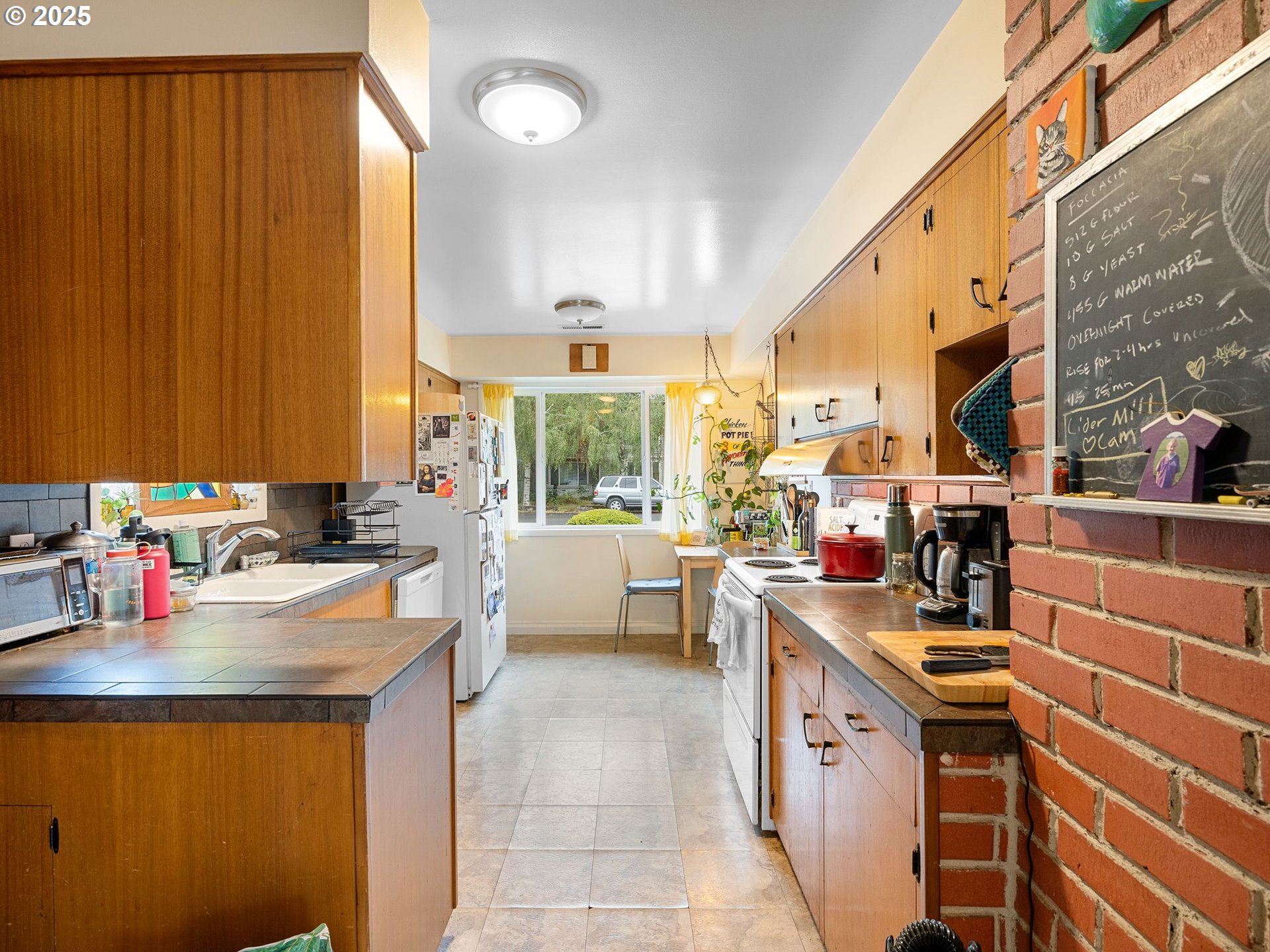 1245 Northeast 118th Avenue Portland, OR 97220 - Photo 7 of 35 a kitchen with a sink and cabinets
