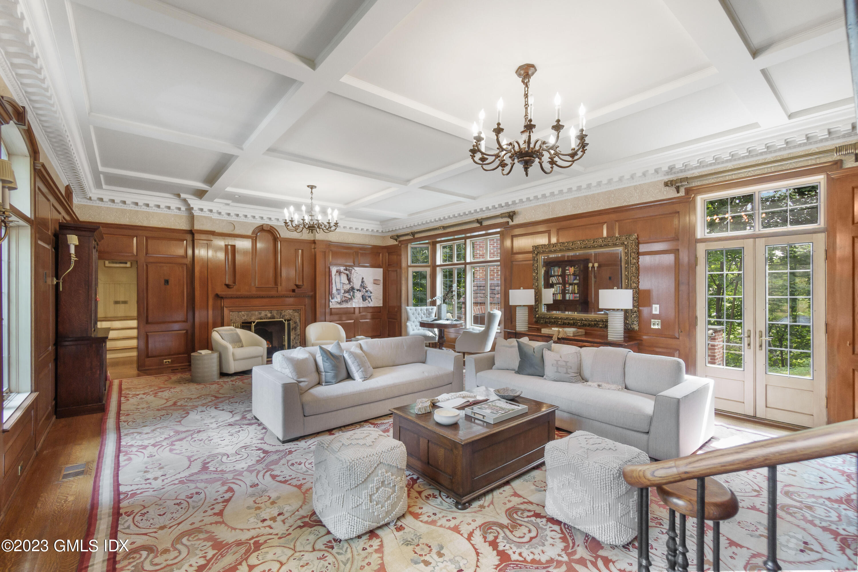 33 Midwood Road Greenwich, CT 06830 - Photo 11 of 22 a living room with patio furniture and a chandelier