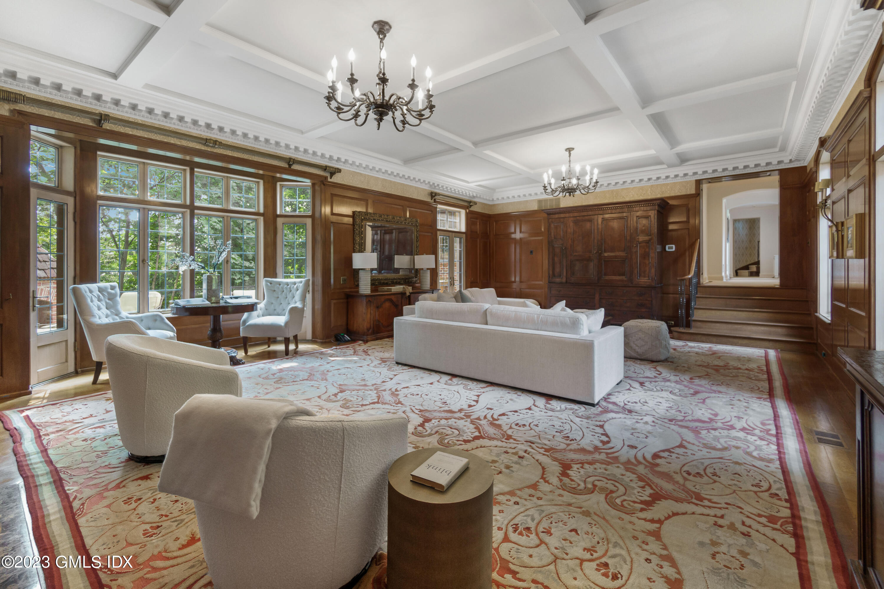 33 Midwood Road Greenwich, CT 06830 - Photo 12 of 22 a living room with furniture and a floor to ceiling window