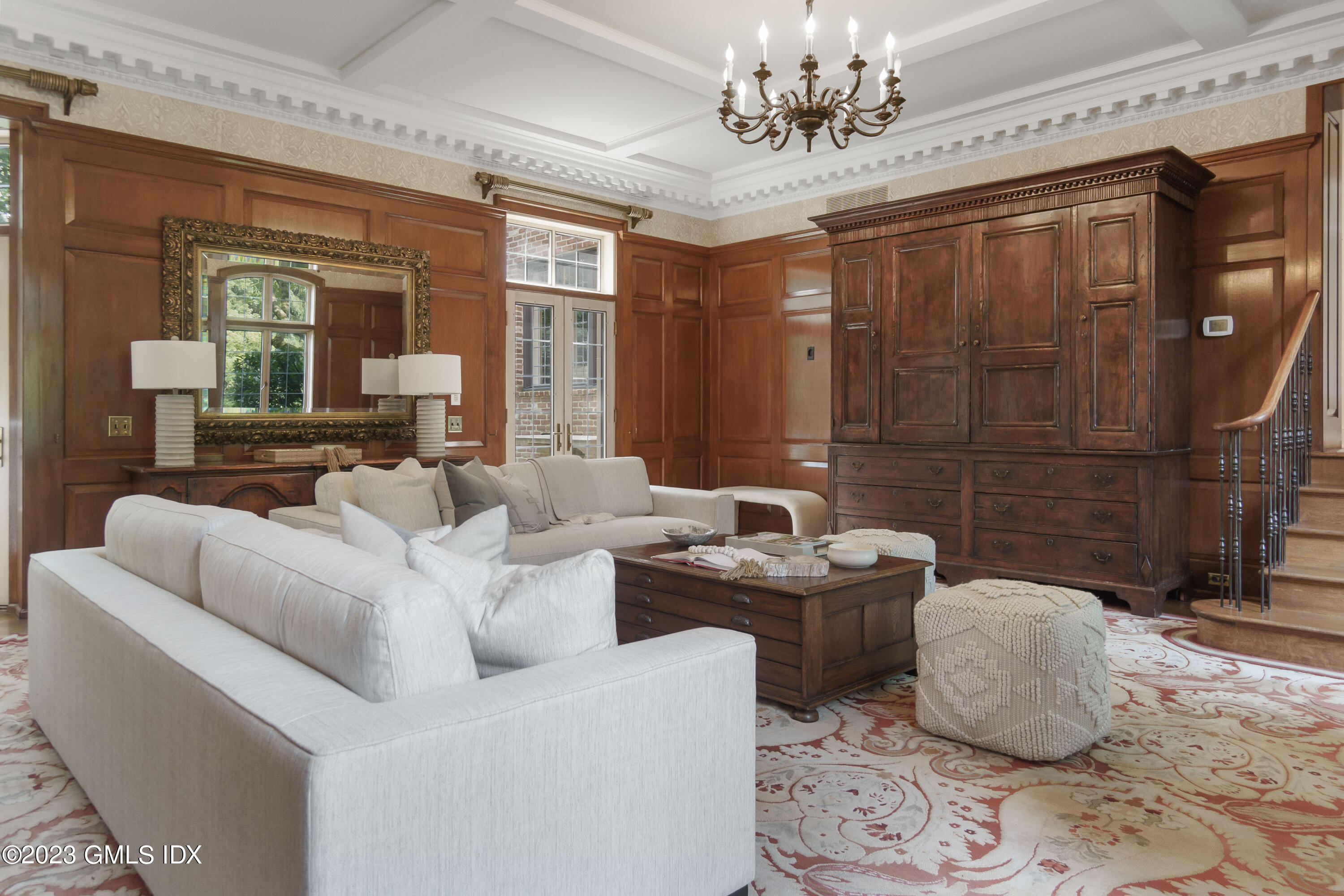 33 Midwood Road Greenwich, CT 06830 - Photo 13 of 22 a living room with furniture and a chandelier
