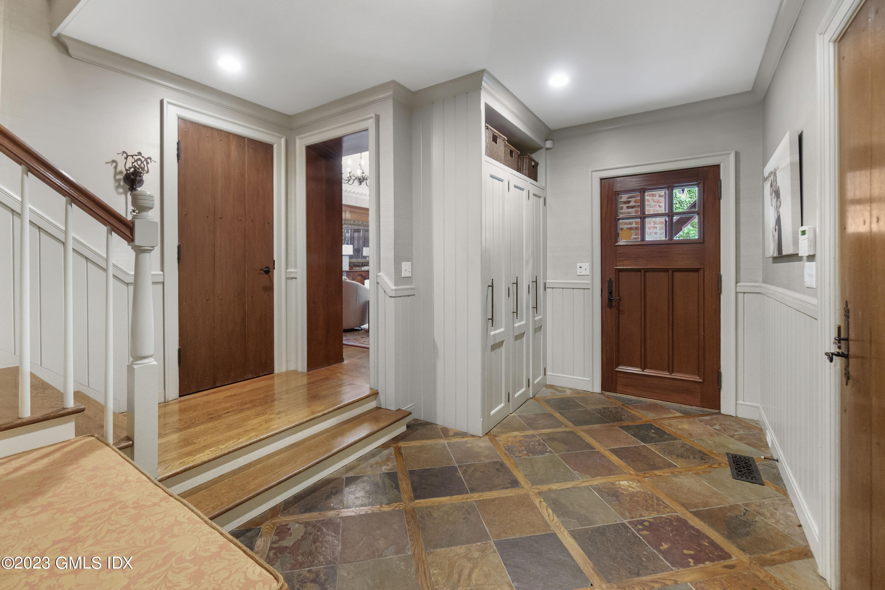 33 Midwood Road Greenwich, CT 06830 - Photo 16 of 22 a view of a hallway with windows and stairs