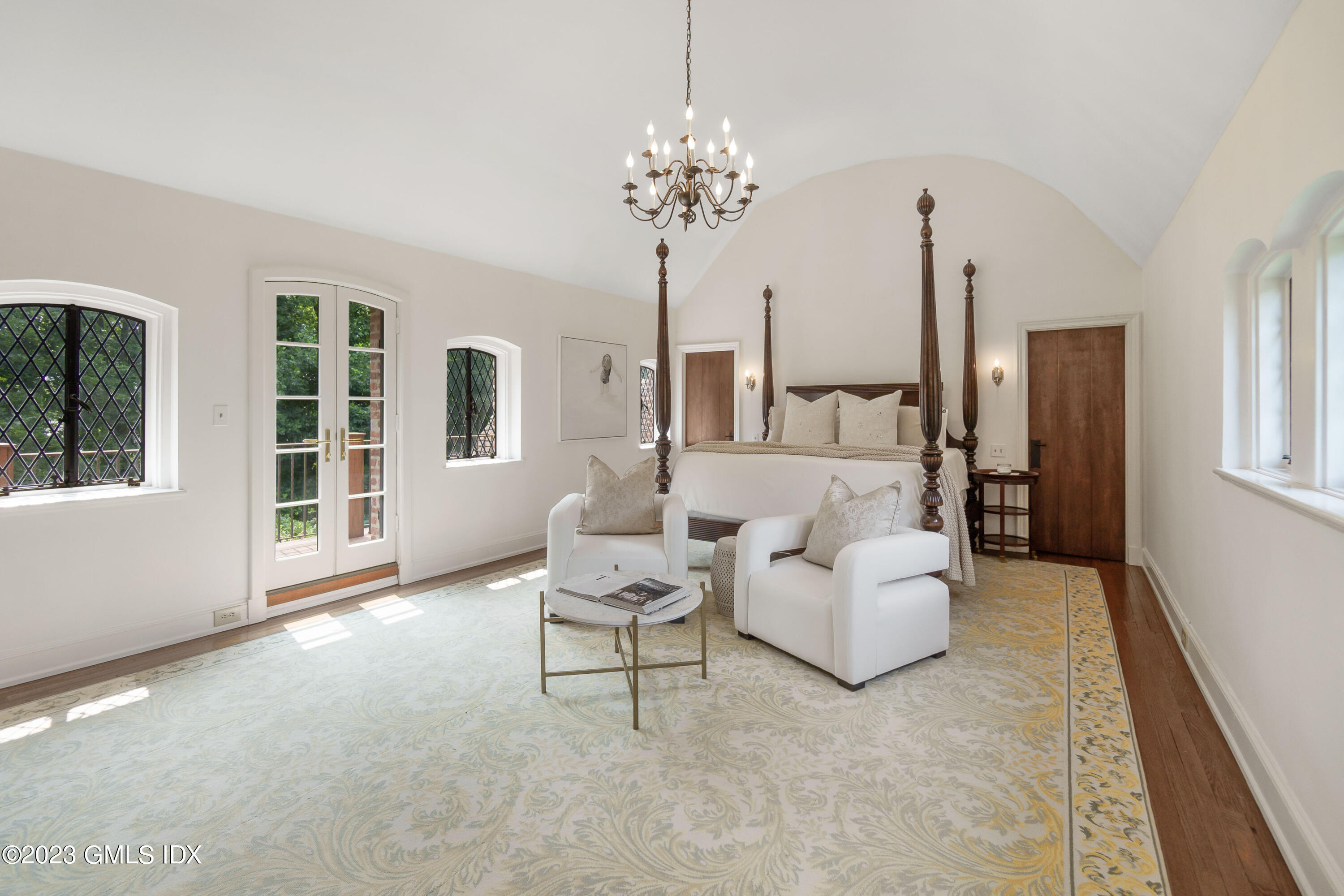 33 Midwood Road Greenwich, CT 06830 - Photo 17 of 22 a living room with furniture and a chandelier