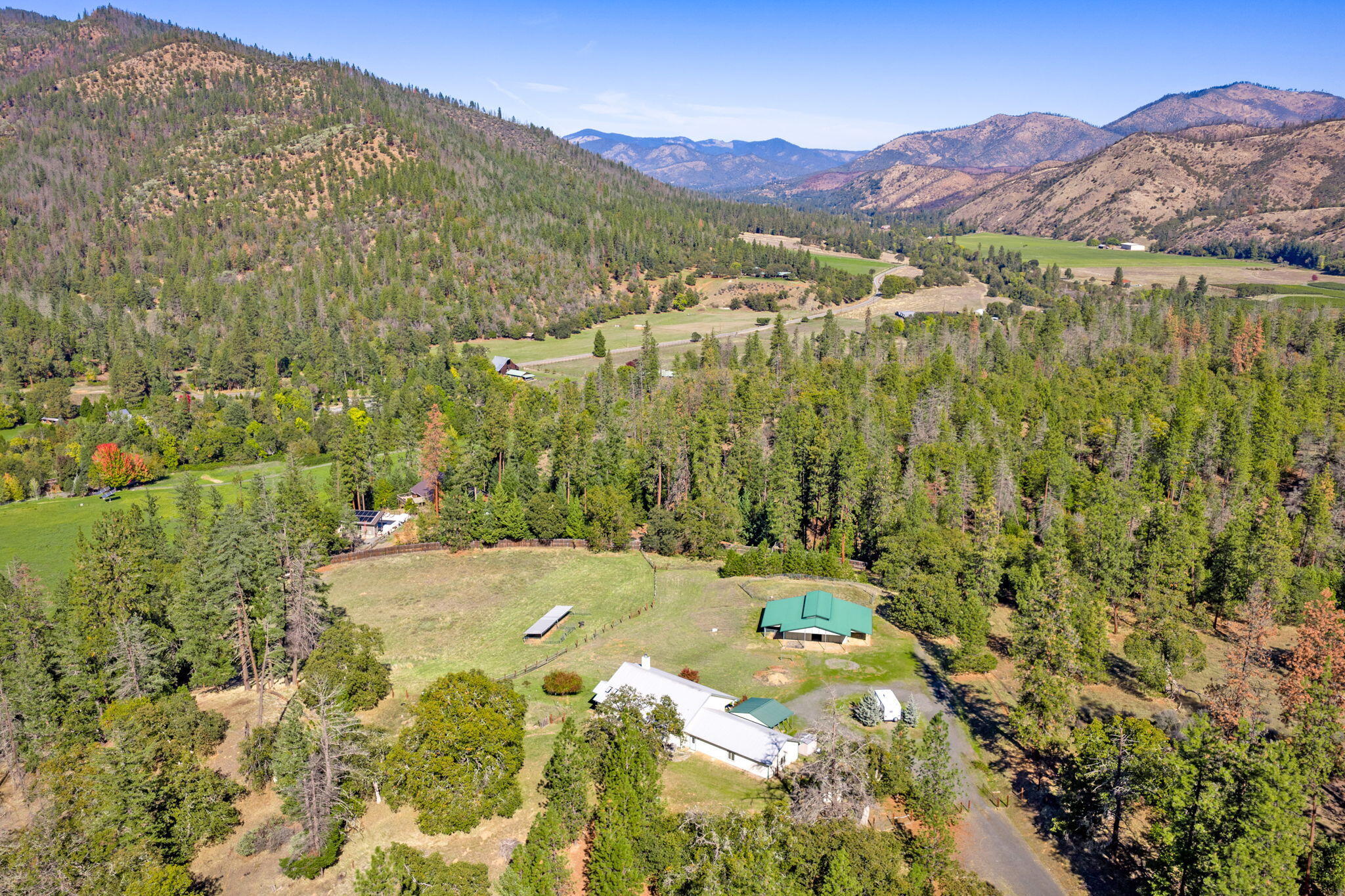 2467 Eastside Road Jacksonville, OR 97530 - Photo 12 of 85 a view of a lush green hillside and houses