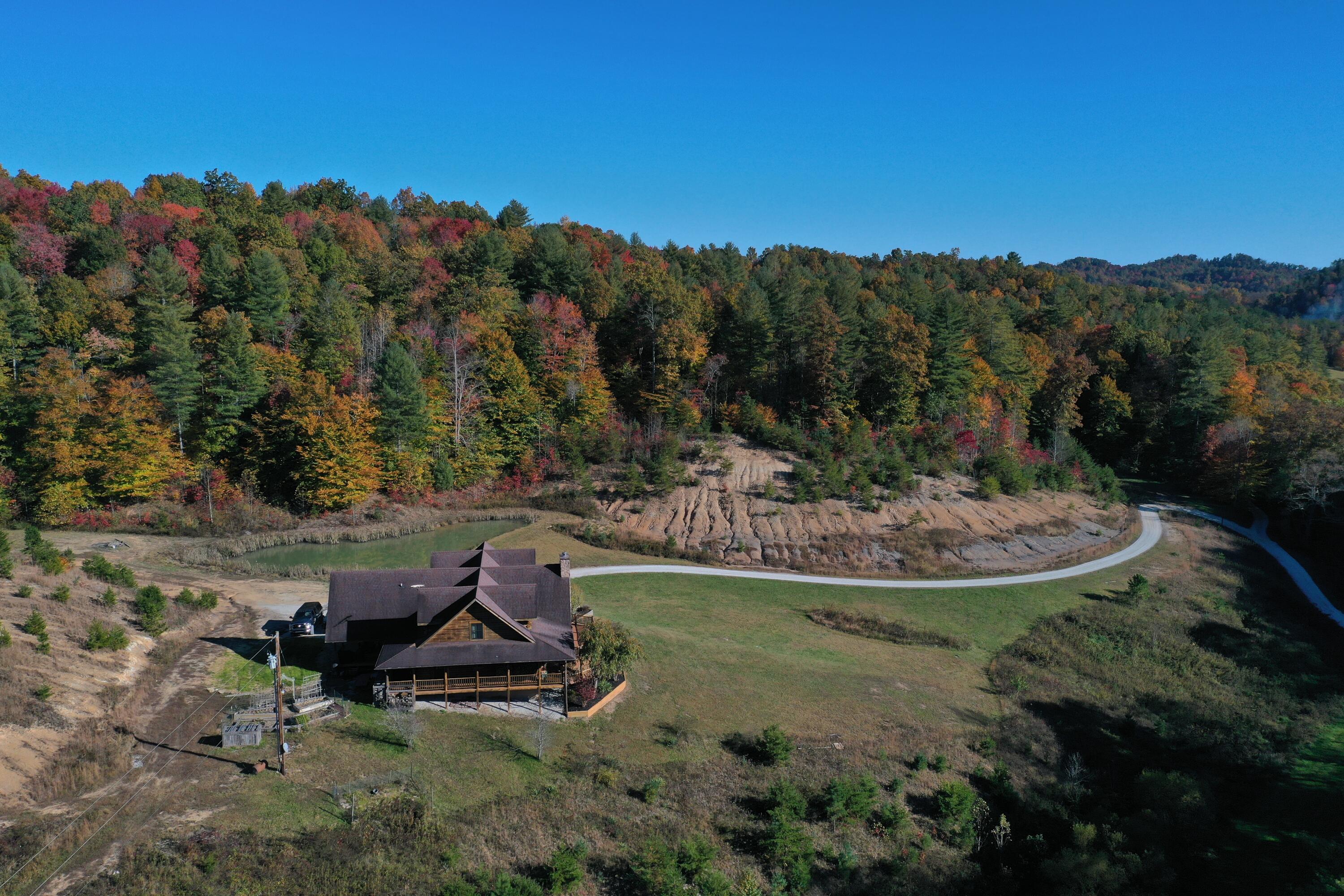 431 Harold Luke Road Campton, KY 41301 - Photo 28 of 82 028 aerial drone shot of the log home fr